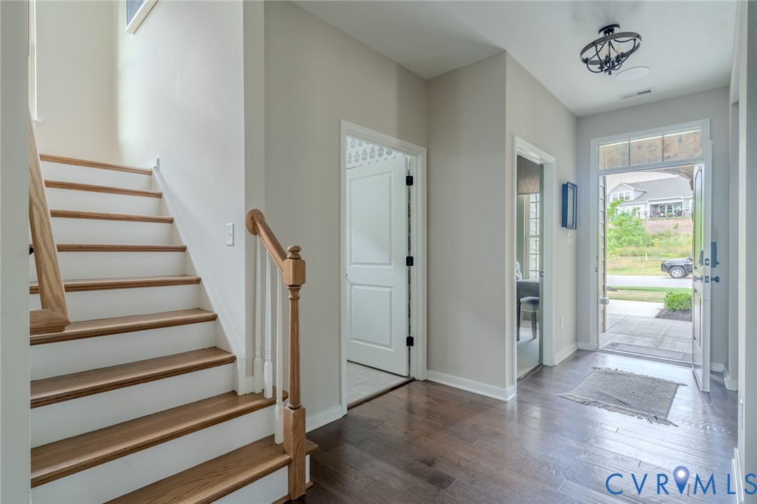 15906 Canoe Pointe Loop, Unit 144 Moseley, VA 23120 - Photo 22 of 22 a view of a hallway with wooden floor and entryway