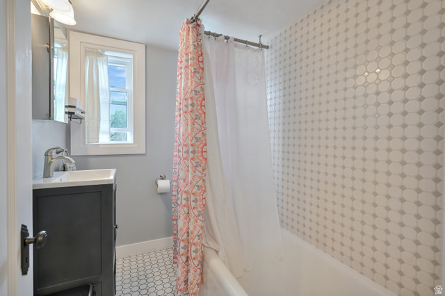 250 West 100 North Logan, UT 84321 - Photo 28 of 41 Bathroom with vanity, shower / bath combination, and light tile patterned floors