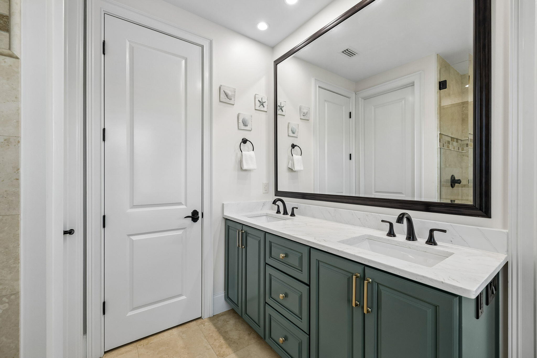 1973 Baytowne Loop Miramar Beach, FL 32550 - Photo 26 of 38 a bathroom with 2 sink and a mirror