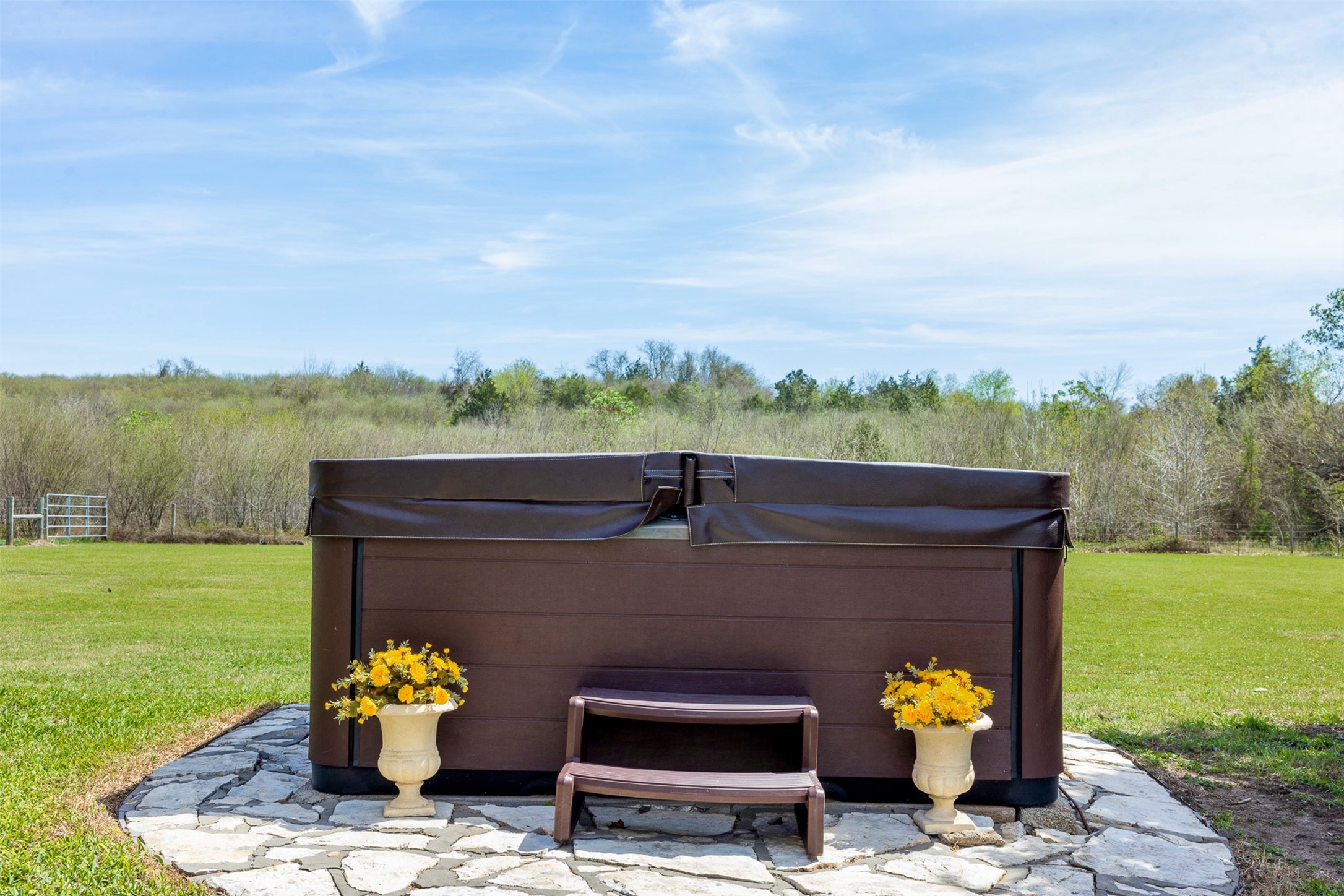 999 Salem Road Brenham, TX 77833 - Photo 11 of 31 a view of a couches and a table in the patio