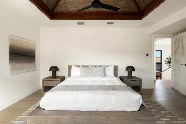 a large white bed in a white room