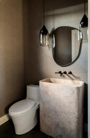 a bathroom with a toilet and sink