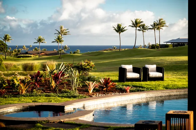 a view of a lake with a table and chairs
