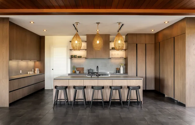 a kitchen with a table and chairs in it