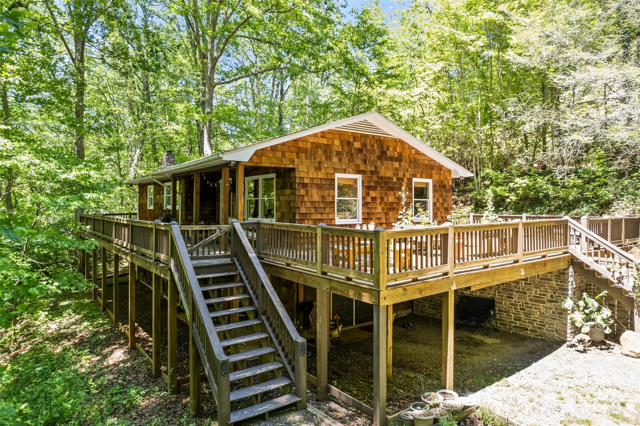 823 Turtle Creek Road Sylva, NC 28779 - Photo 1 of 38 a front view of a house with a balcony