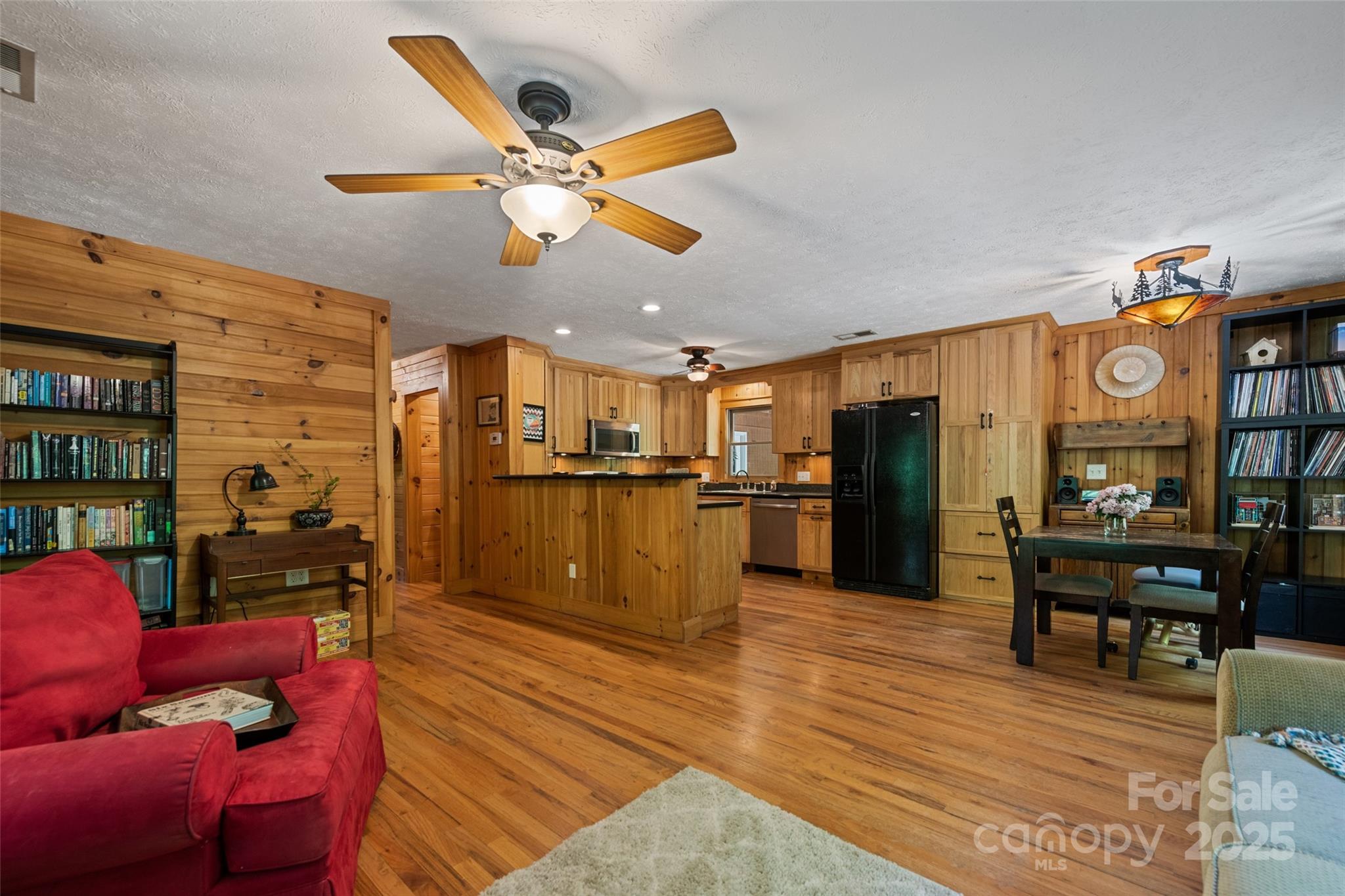 823 Turtle Creek Road Sylva, NC 28779 - Photo 11 of 38 a living room with furniture and kitchen view