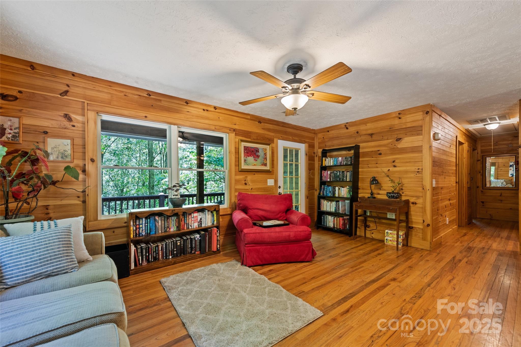 823 Turtle Creek Road Sylva, NC 28779 - Photo 12 of 38 a living room with furniture fireplace and wooden floor