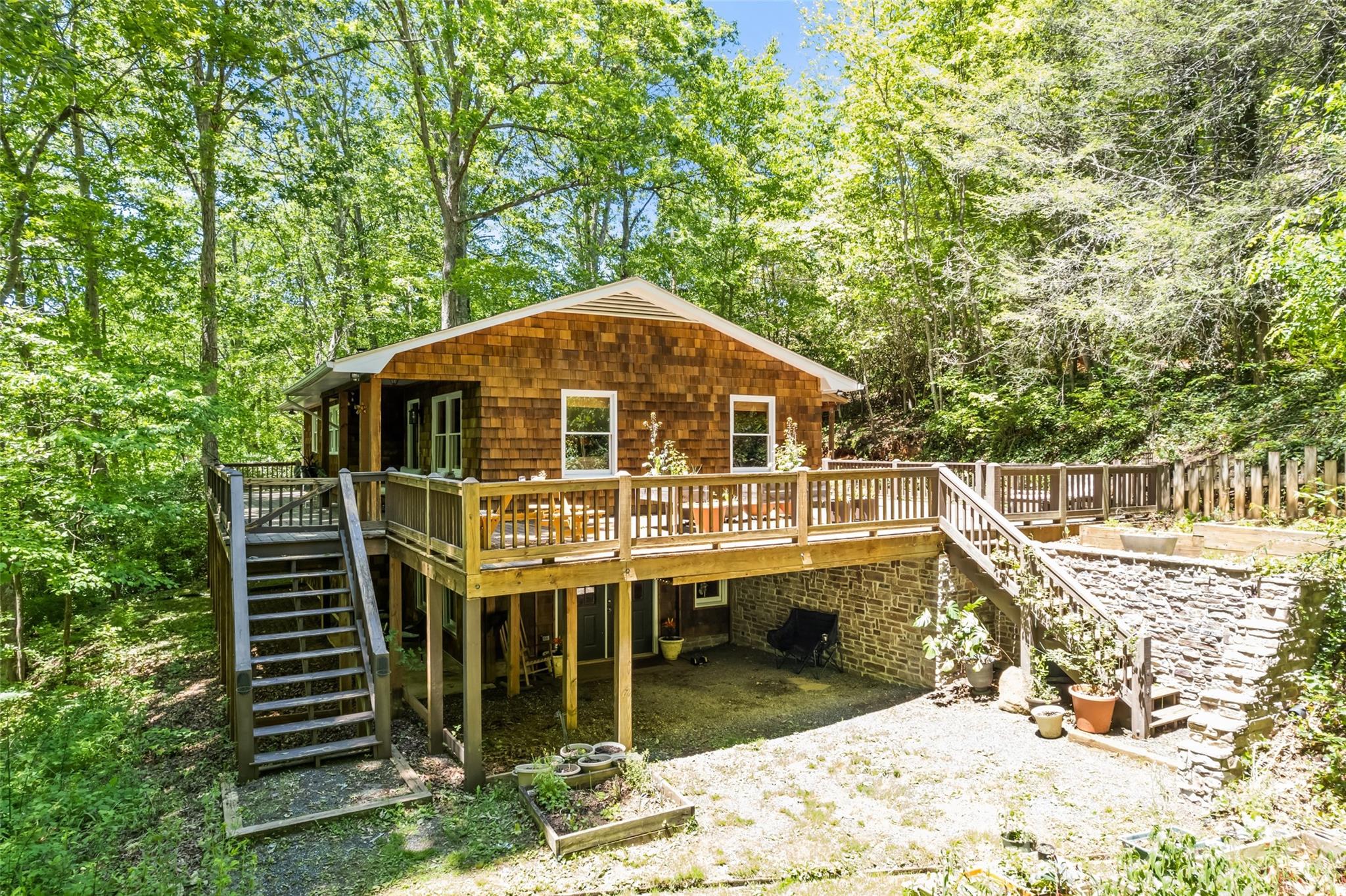 823 Turtle Creek Road Sylva, NC 28779 - Photo 2 of 38 a view of a house with backyard porch and sitting area