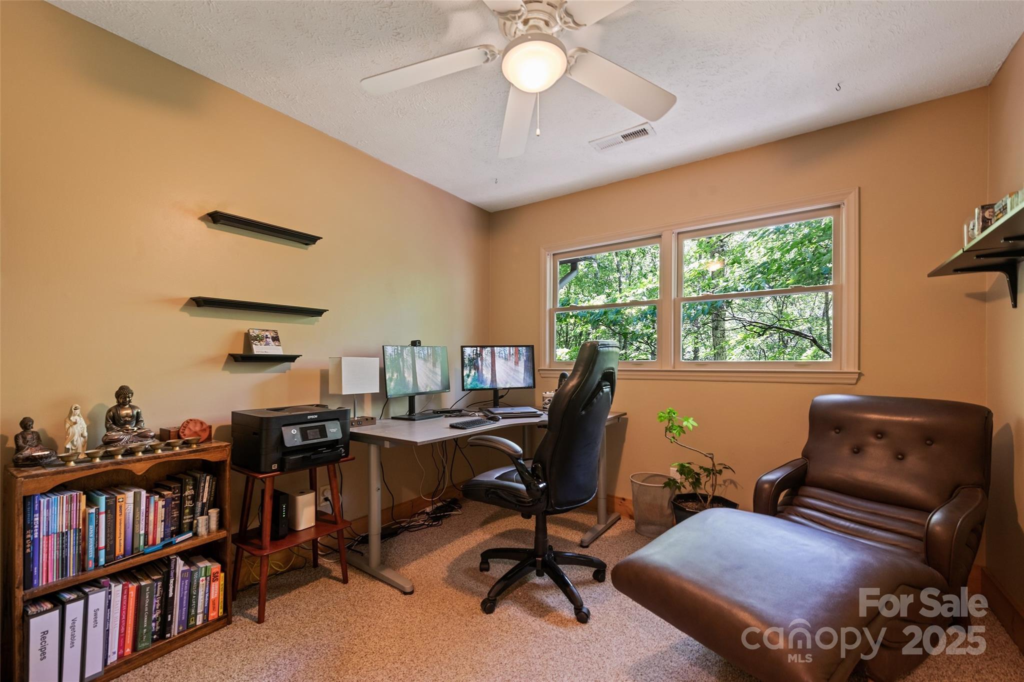 823 Turtle Creek Road Sylva, NC 28779 - Photo 26 of 38 a view of a workspace with furniture and a window