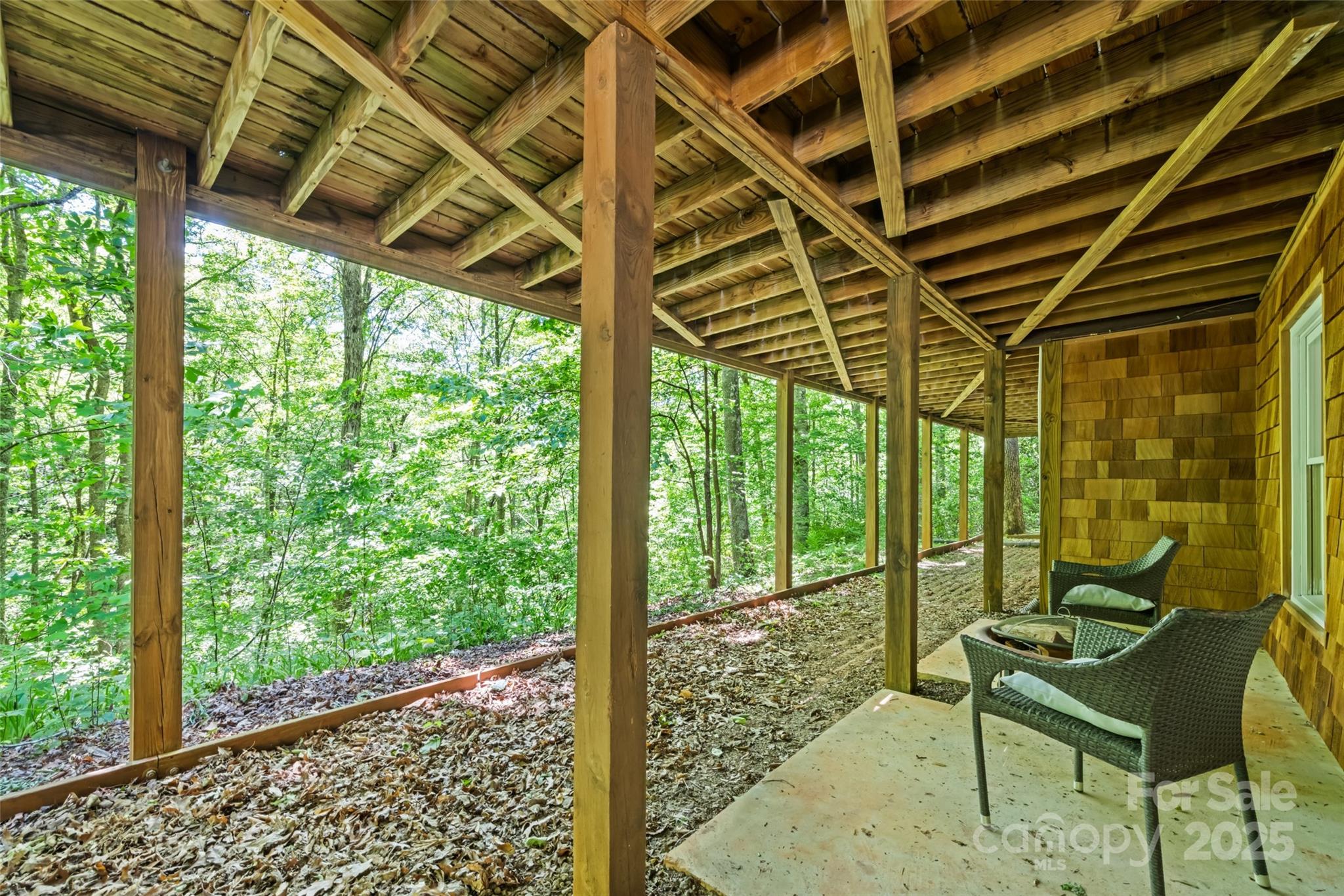 823 Turtle Creek Road Sylva, NC 28779 - Photo 29 of 38 a view of a room with wooden floor and iron walls