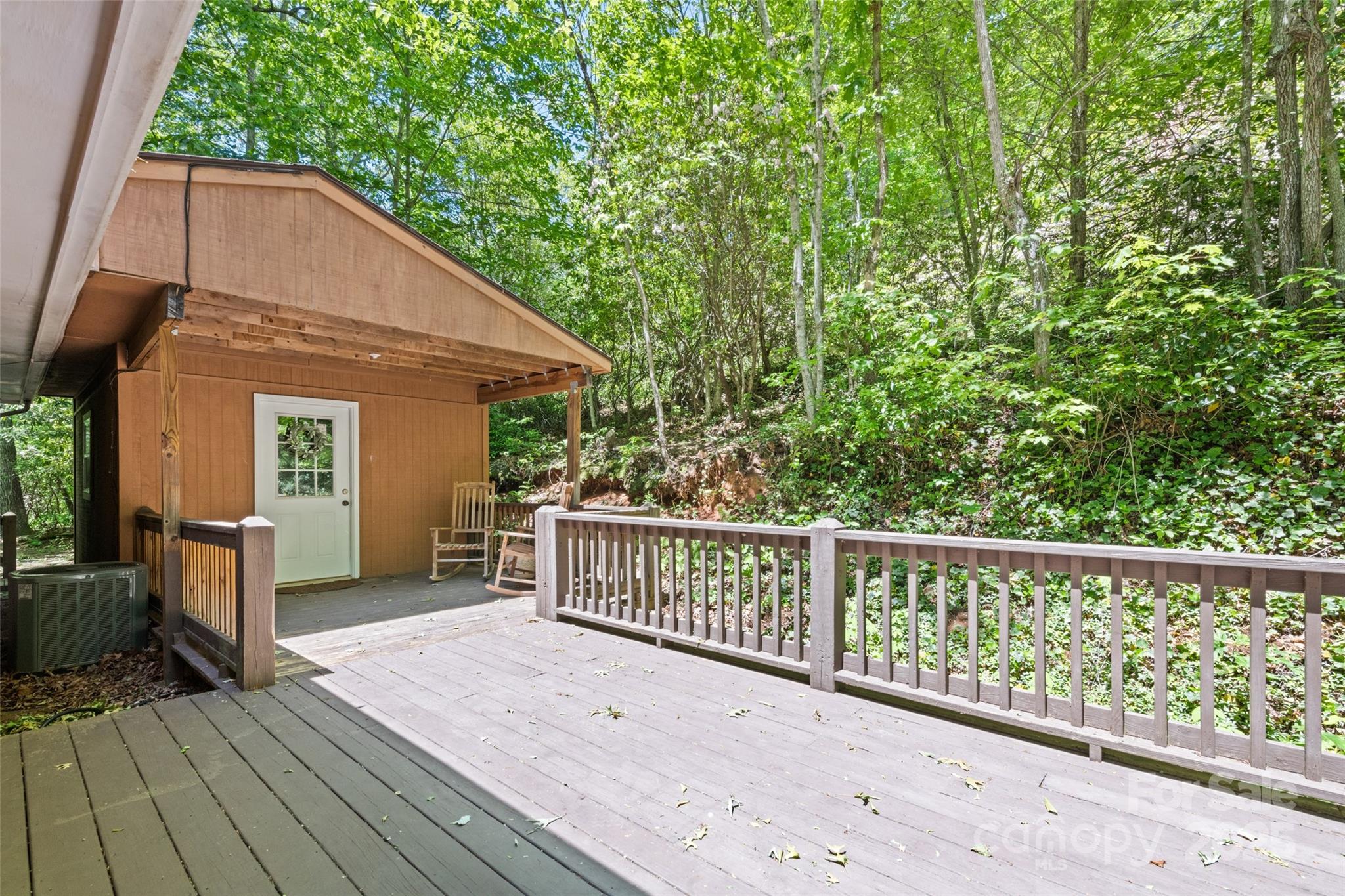 823 Turtle Creek Road Sylva, NC 28779 - Photo 34 of 38 a view of a house with backyard and deck