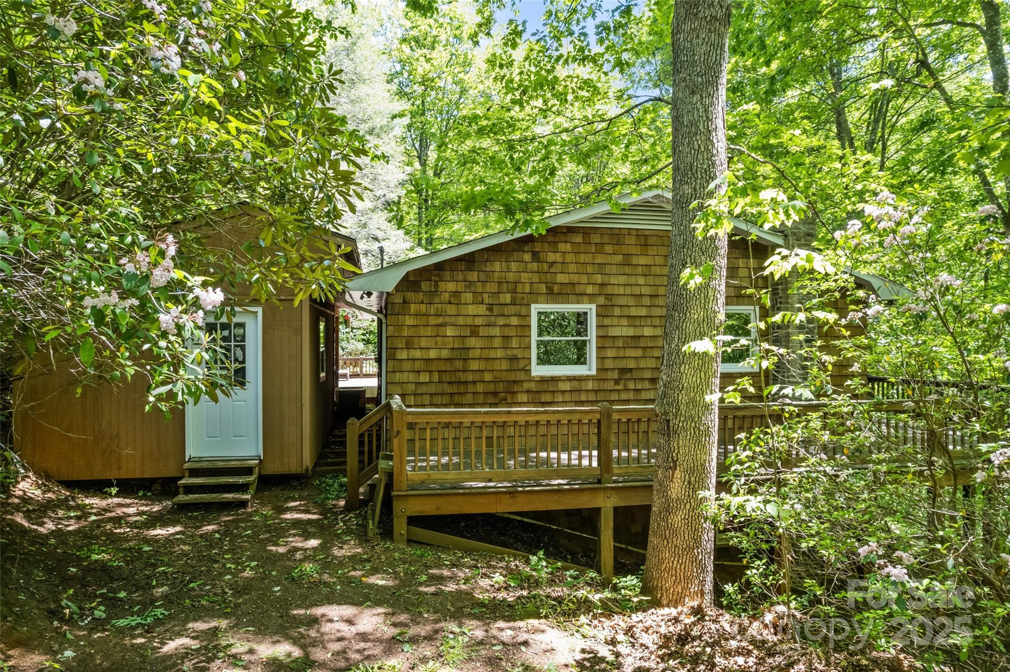 823 Turtle Creek Road Sylva, NC 28779 - Photo 35 of 38 a view of a house with a yard