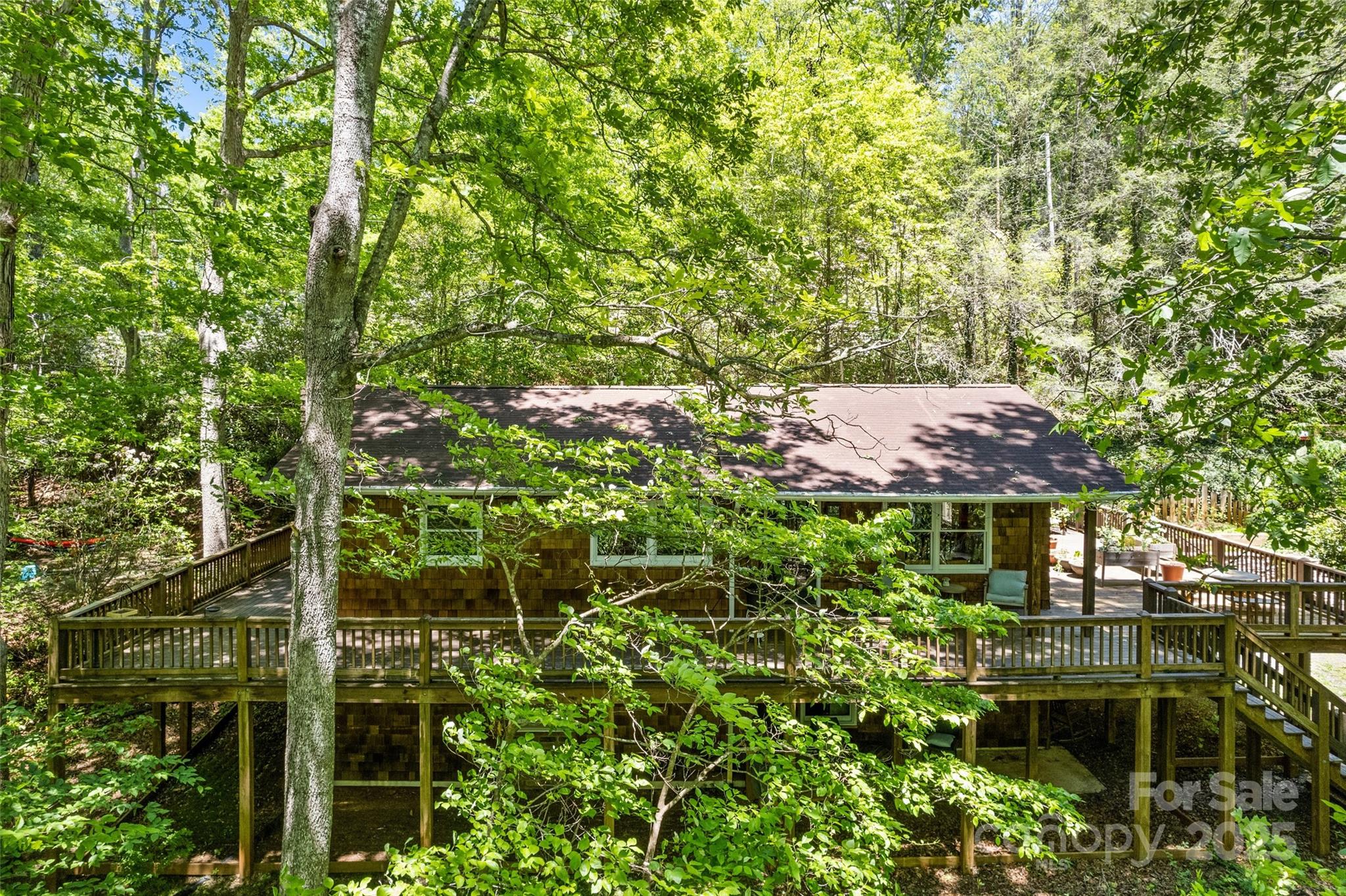 823 Turtle Creek Road Sylva, NC 28779 - Photo 4 of 38 a view of a house with a tree