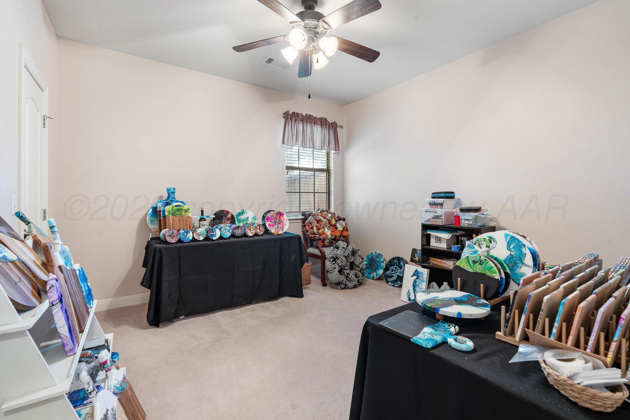 5008 Wesley Road Amarillo, TX 79119 - Photo 39 of 47 a living room with furniture flowerpot and a chandelier