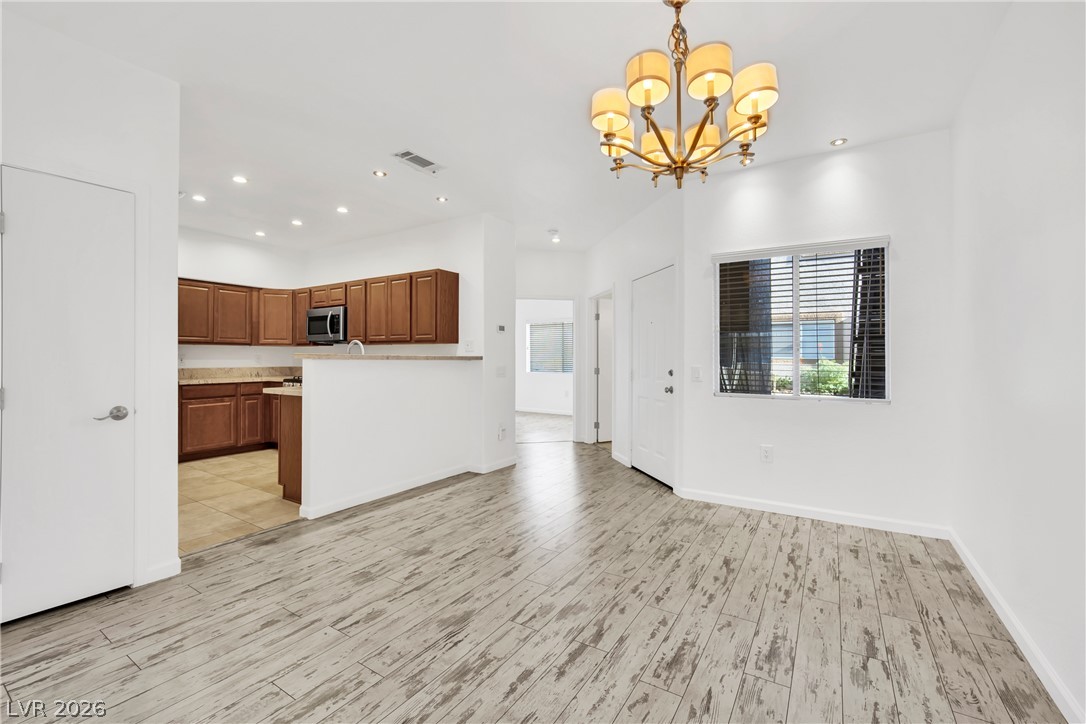 8725 West Flamingo Road, Unit 110 Las Vegas, NV 89147 - Photo 30 of 30 An open floor plan seamlessly connects the well-appointed kitchen with the main living area, perfect for daily life.