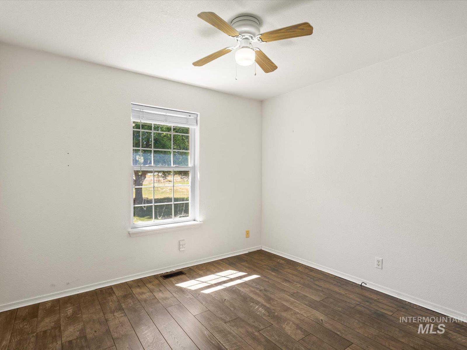 3540 Wills Road Emmett, ID 83617 - Photo 20 of 36 Spacious room featuring wood-finish flooring and a ceiling fan with light fixture