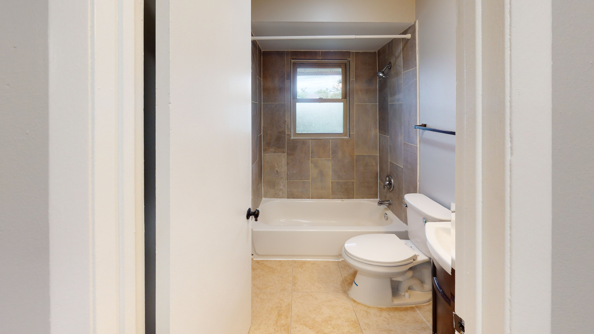 101 Sunset Drive, Unit 2E4 Cary, IL 60013 - Photo 7 of 8 a bathroom with a toilet and a shower