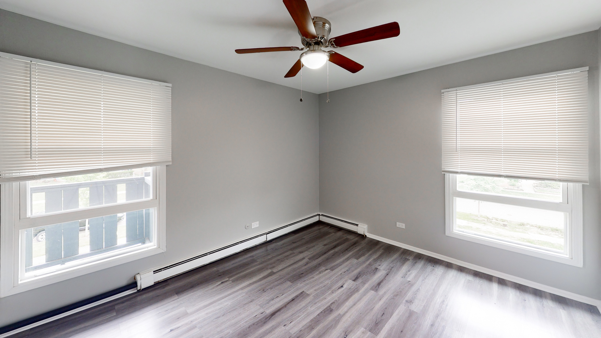 101 Sunset Drive, Unit 2E4 Cary, IL 60013 - Photo 8 of 8 wooden floor in an empty room with a window
