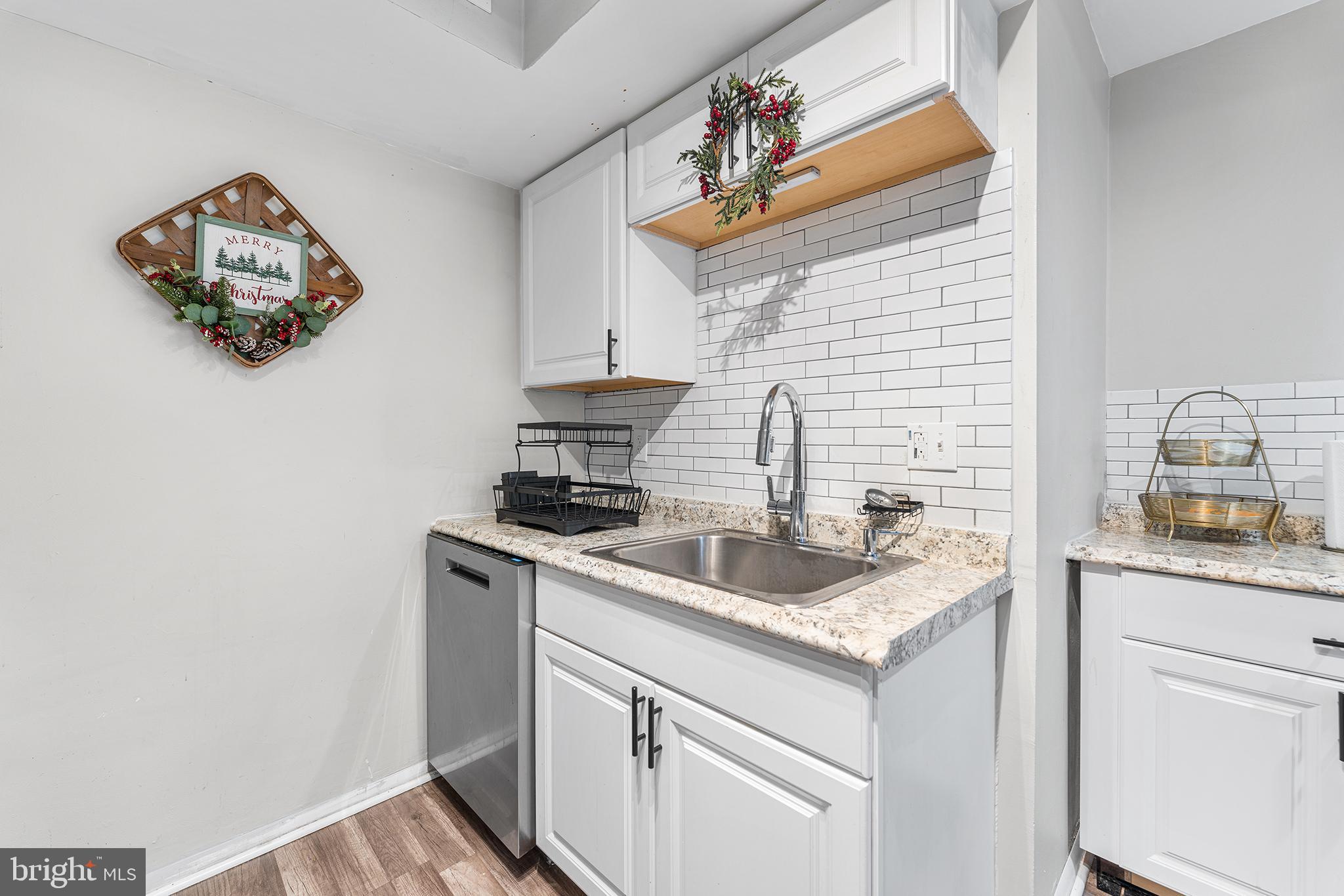 115 East Kings Highway, Unit 186 Maple Shade, NJ 08052 - Photo 12 of 25 a kitchen with stainless steel appliances granite countertop a sink stove and cabinets
