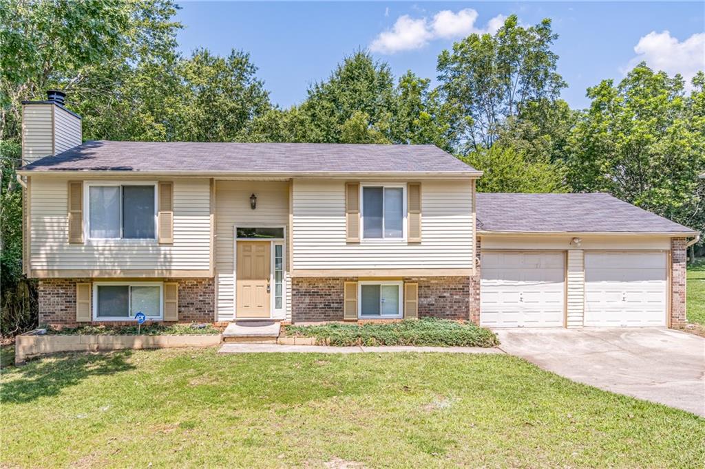 2407 Redfield Drive Norcross, GA 30071 - Photo 1 of 37 a front view of a house with a yard