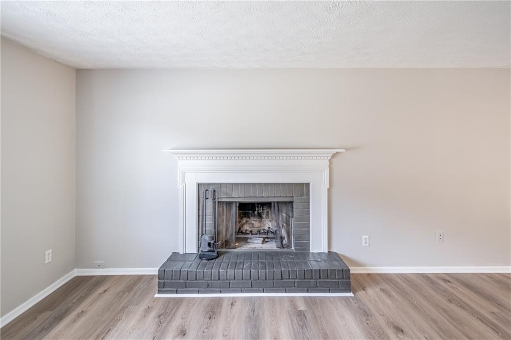 2407 Redfield Drive Norcross, GA 30071 - Photo 11 of 37 a living room with a fireplace