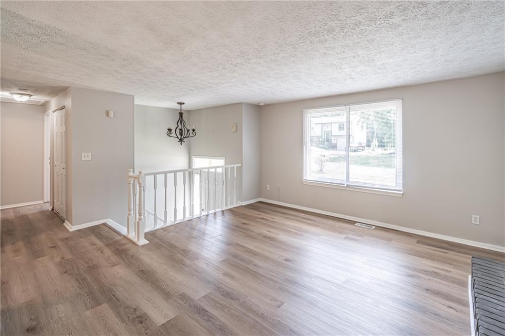2407 Redfield Drive Norcross, GA 30071 - Photo 12 of 37 a view of a livingroom with wooden floor and a window