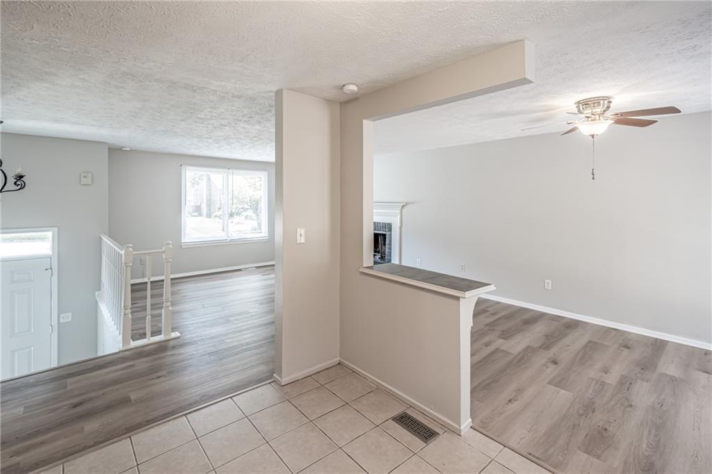 2407 Redfield Drive Norcross, GA 30071 - Photo 18 of 37 wooden floor in an empty room with a window
