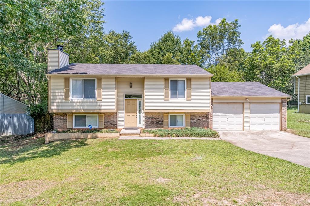 2407 Redfield Drive Norcross, GA 30071 - Photo 2 of 37 a front view of a house with a yard