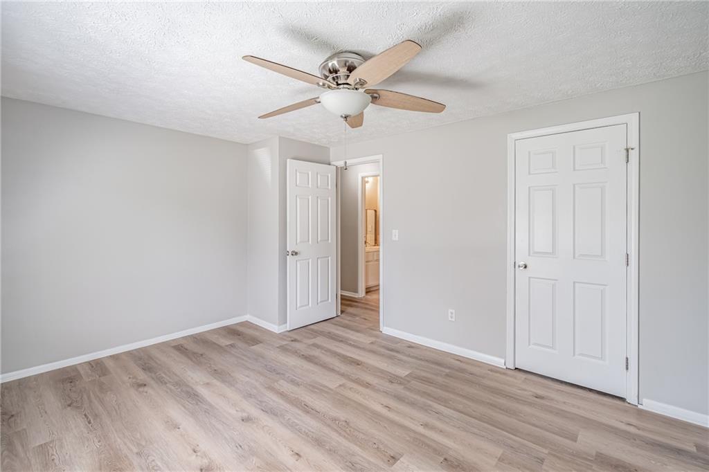 2407 Redfield Drive Norcross, GA 30071 - Photo 22 of 37 a view of an empty room with wooden floor