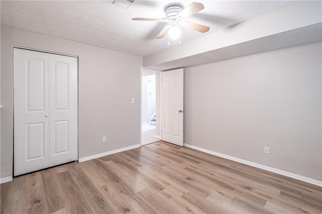 2407 Redfield Drive Norcross, GA 30071 - Photo 31 of 37 a view of an empty room with wooden floor