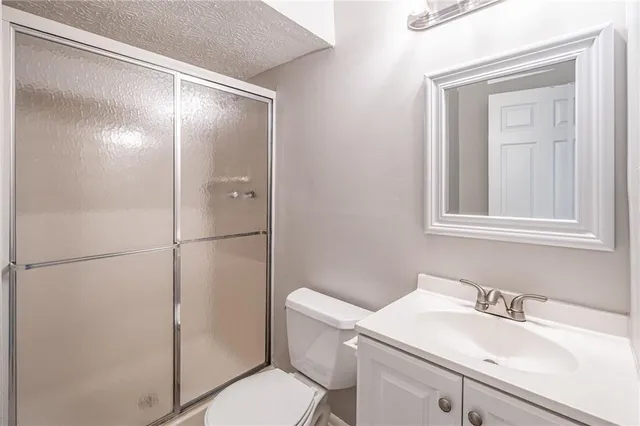 a balcony with wooden floor and fence