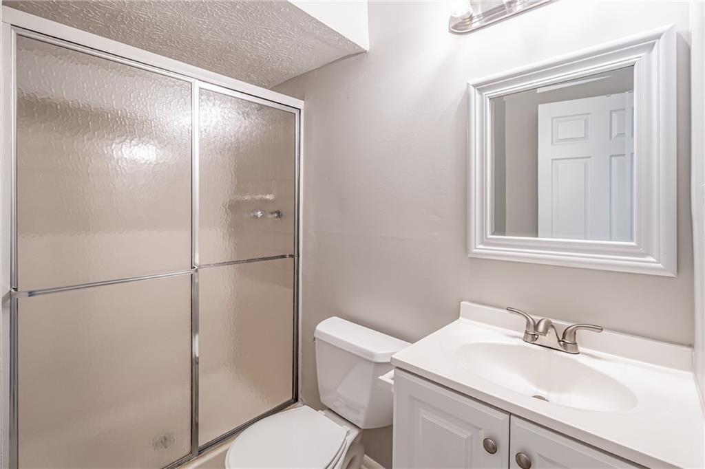 2407 Redfield Drive Norcross, GA 30071 - Photo 32 of 37 a bathroom with a sink toilet and vanity
