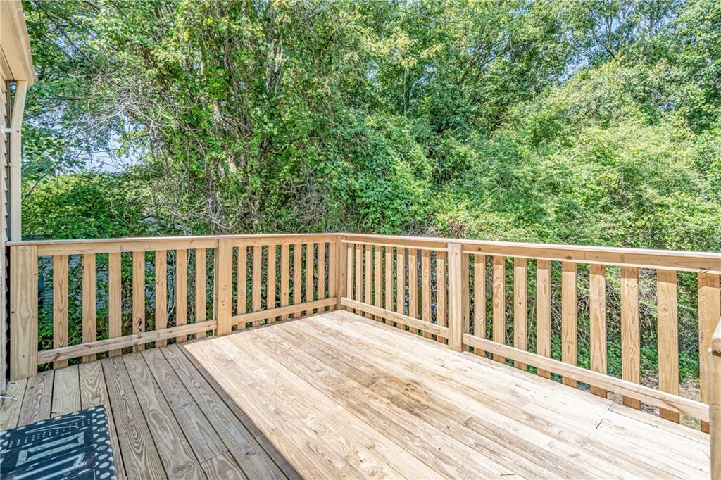 2407 Redfield Drive Norcross, GA 30071 - Photo 34 of 37 a balcony with wooden floor and fence