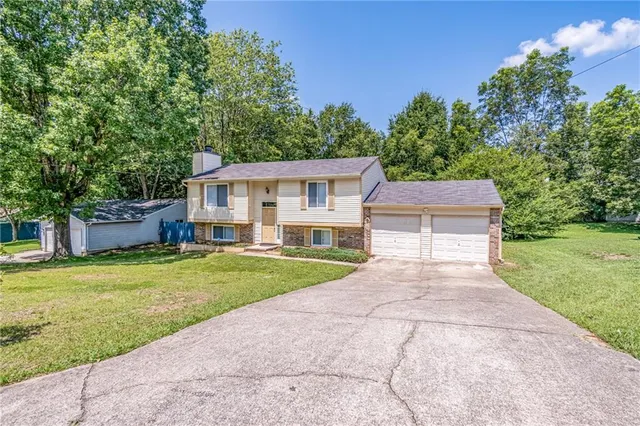 front view of a house with a yard
