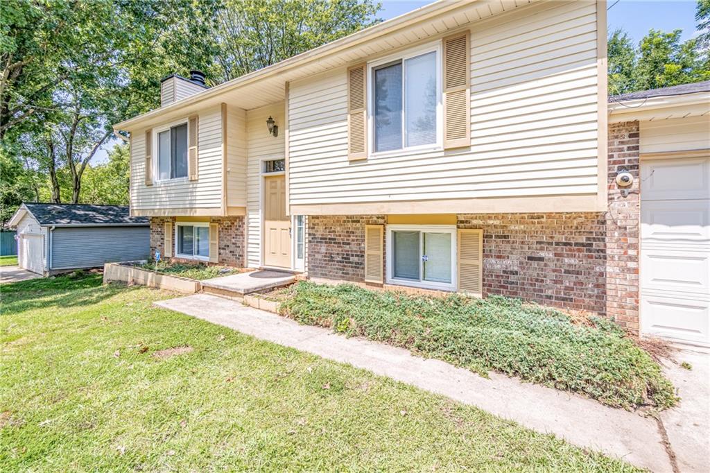 2407 Redfield Drive Norcross, GA 30071 - Photo 5 of 37 a front view of a house with a yard and garage