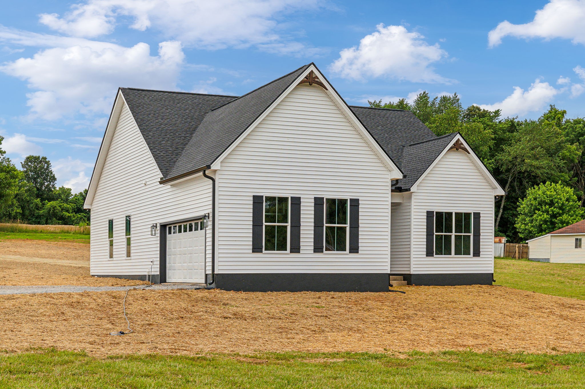 5751 Youngville Road Springfield, TN 37172 - Photo 1 of 45 a front view of a house with a garden