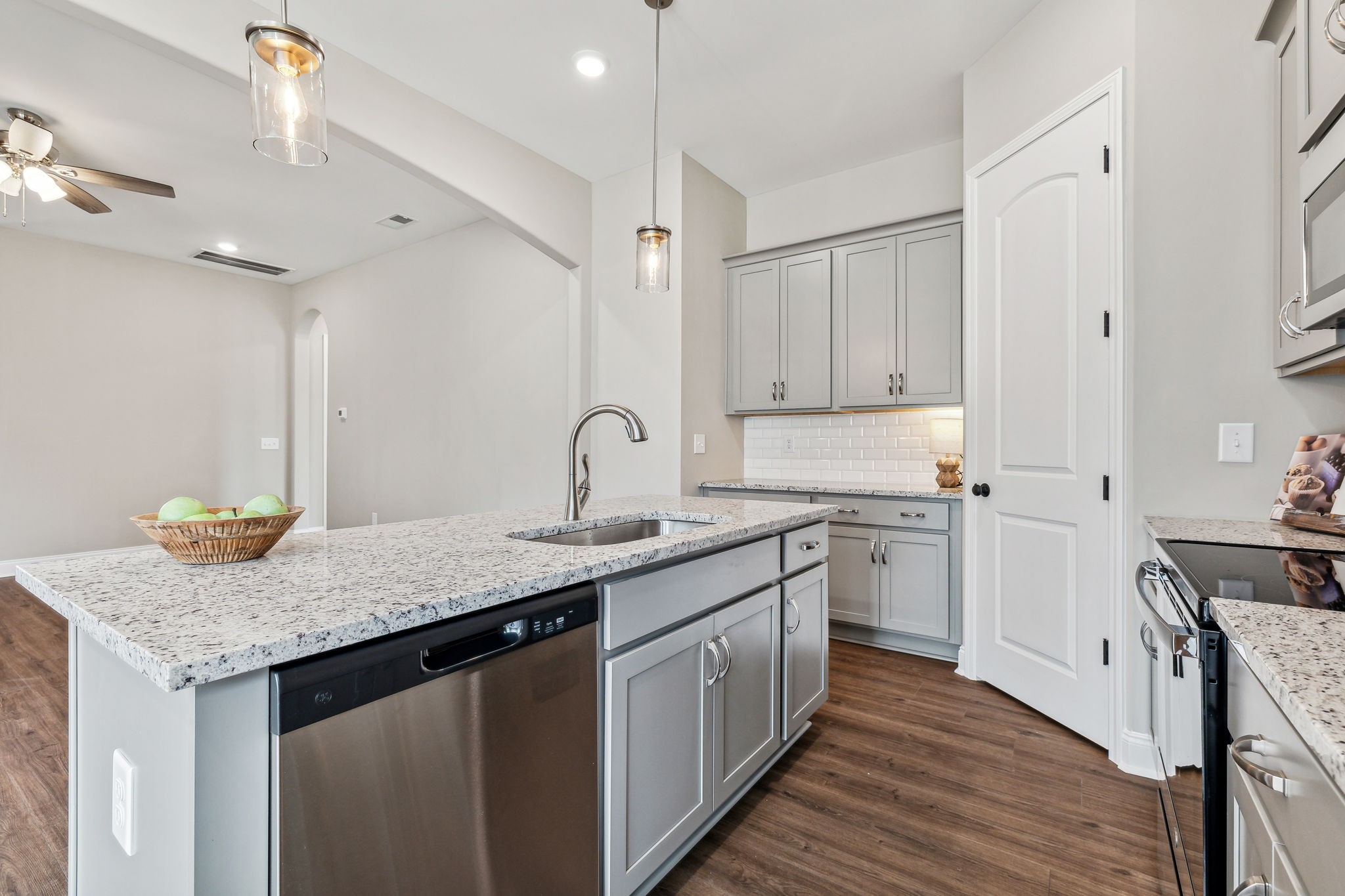5751 Youngville Road Springfield, TN 37172 - Photo 14 of 45 a kitchen with stainless steel appliances granite countertop a sink stove and cabinets