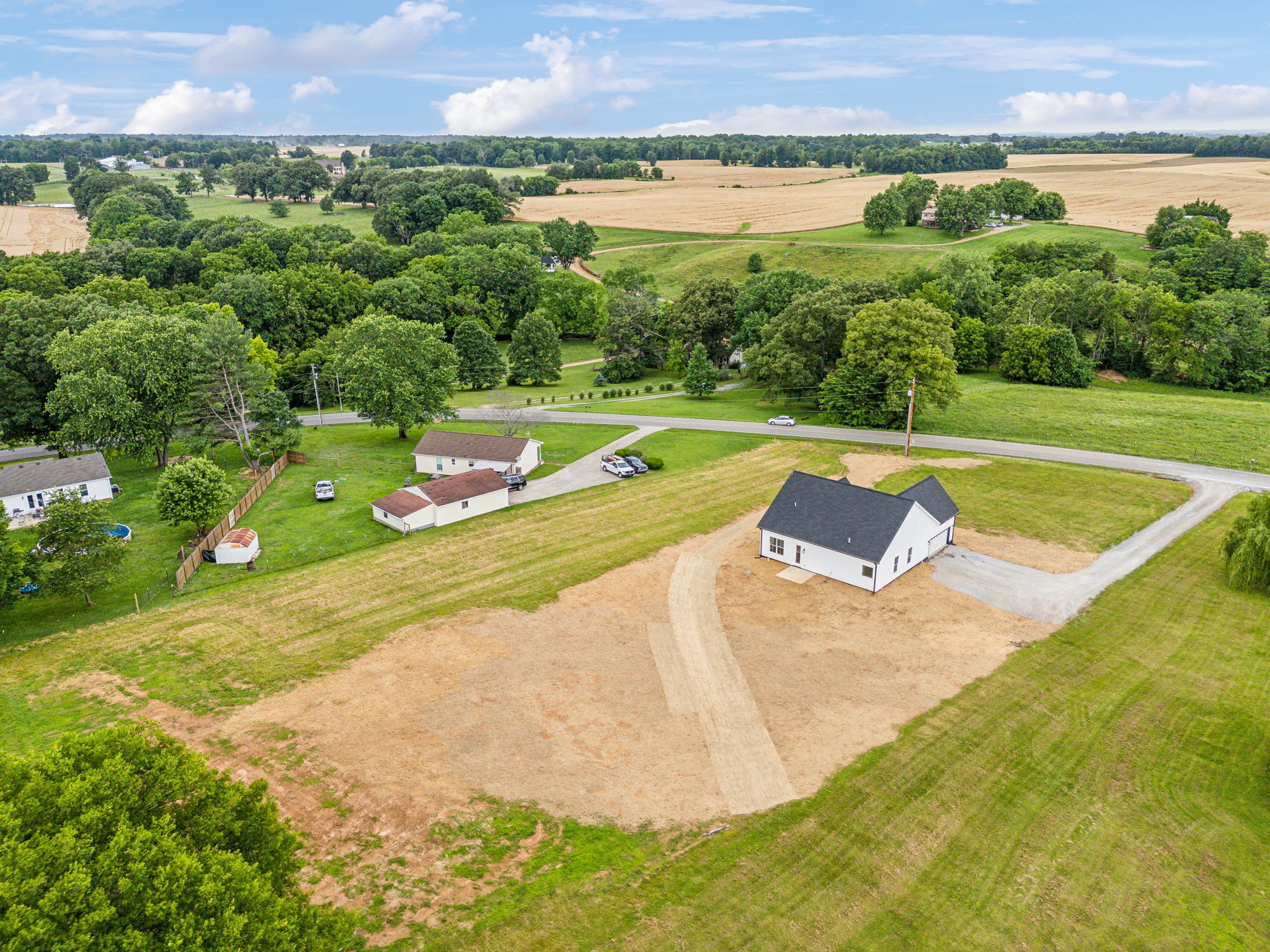5751 Youngville Road Springfield, TN 37172 - Photo 40 of 45 a view of a swimming pool with a yard and plants