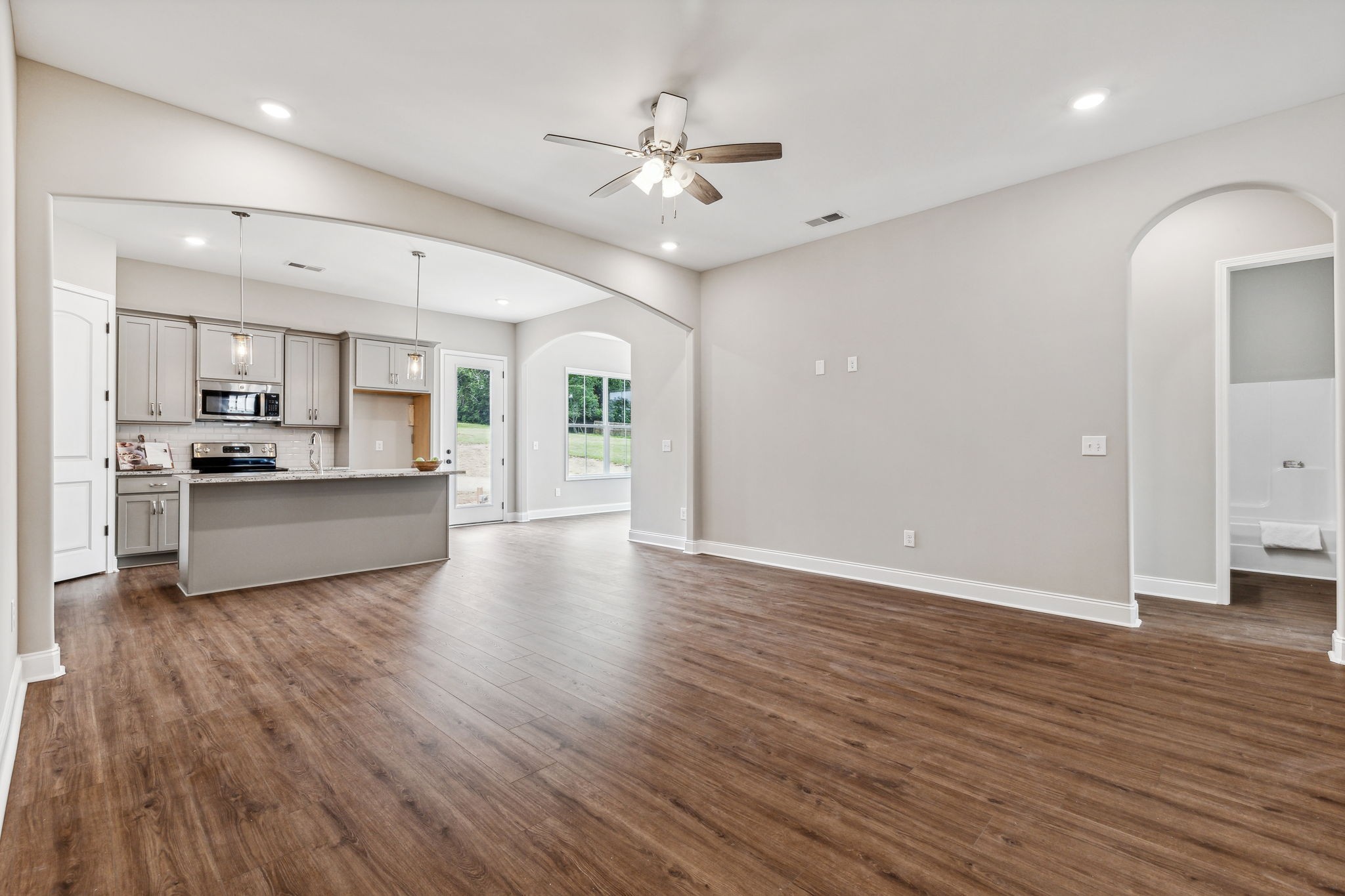 5751 Youngville Road Springfield, TN 37172 - Photo 6 of 45 a view of a kitchen with a sink and dishwasher a refrigerator with wooden floor