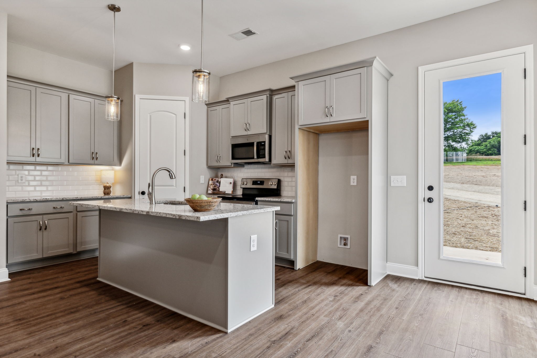 5751 Youngville Road Springfield, TN 37172 - Photo 9 of 45 a kitchen with kitchen island granite countertop a sink cabinets and stainless steel appliances