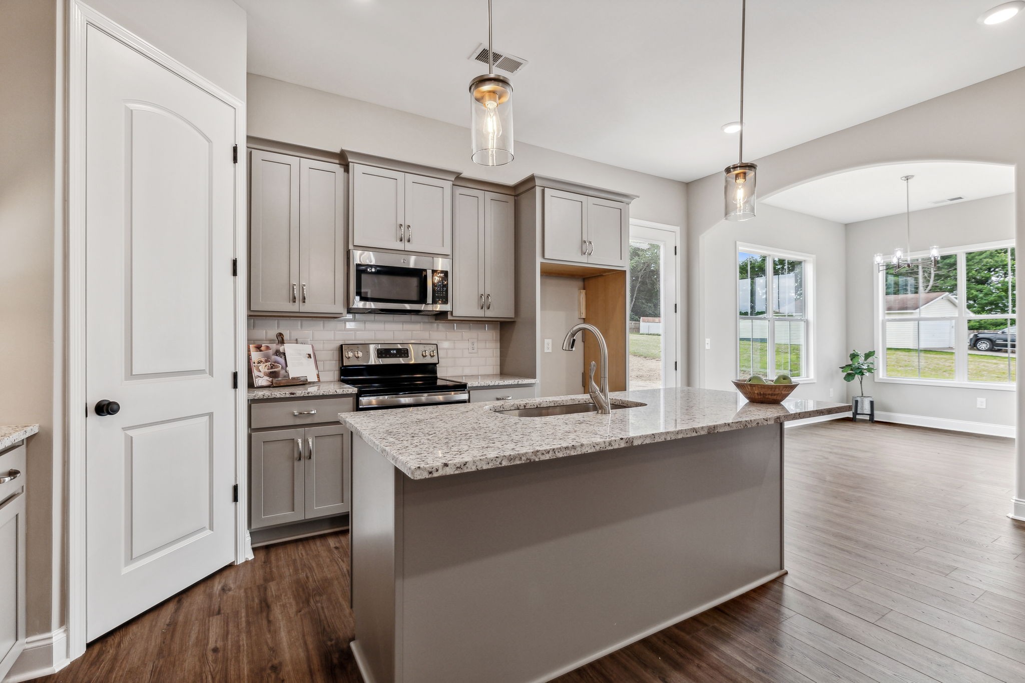 5751 Youngville Road Springfield, TN 37172 - Photo 10 of 45 a kitchen with stainless steel appliances granite countertop a stove a sink and a refrigerator
