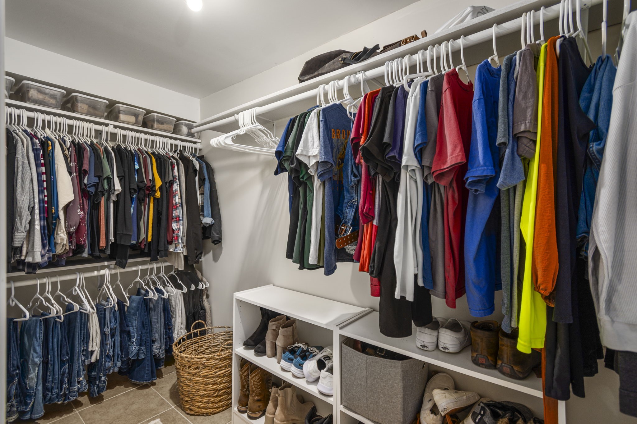 25311 Hardin Store Road Pinehurst, TX 77362 - Photo 16 of 39 a view of walk in closet with clothes