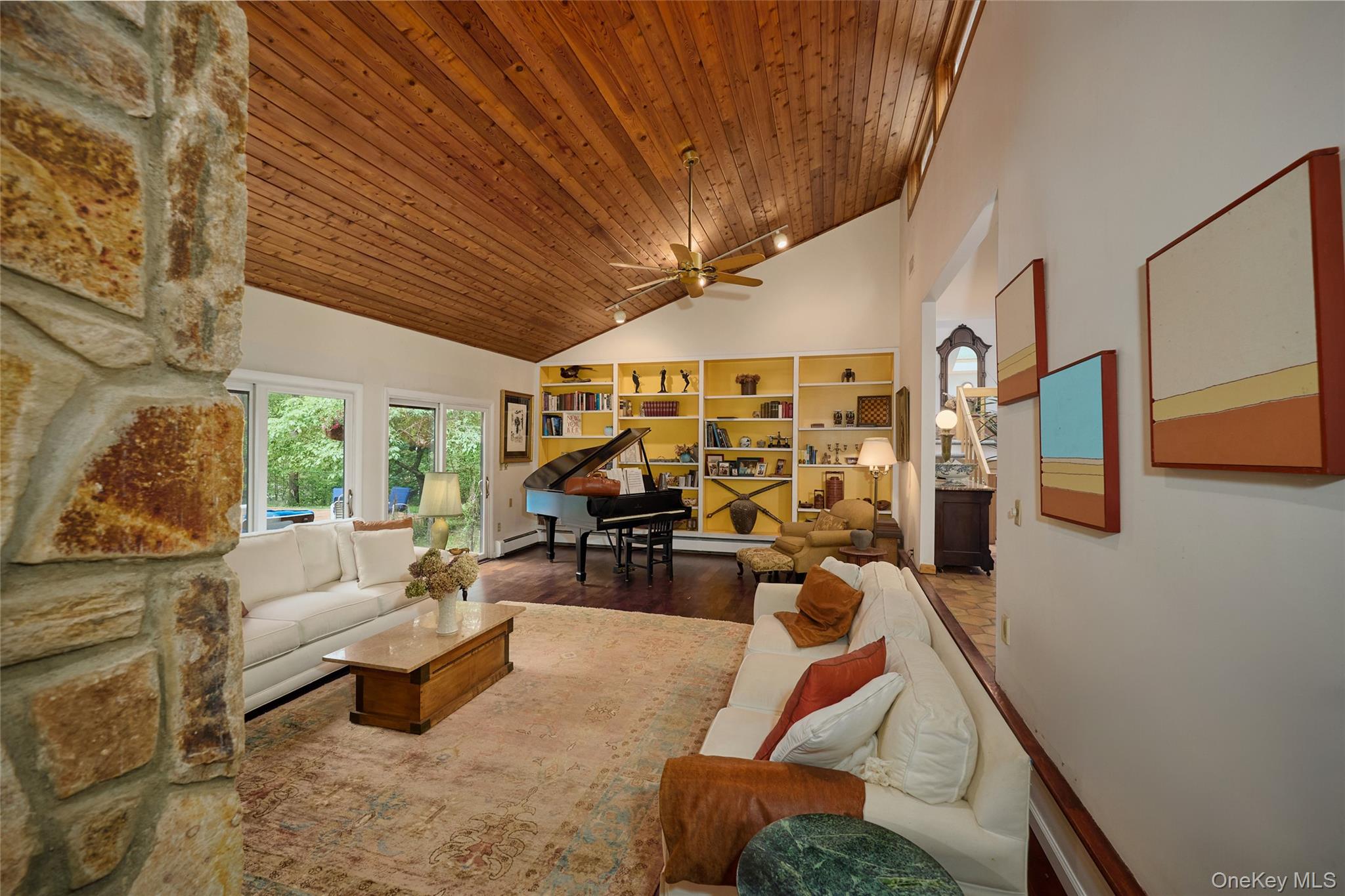 31 Greenlawn Road Katonah, NY 10536 - Photo 13 of 47 Living area featuring high vaulted ceiling, wood ceiling, wood finished floors, ceiling fan, and baseboards