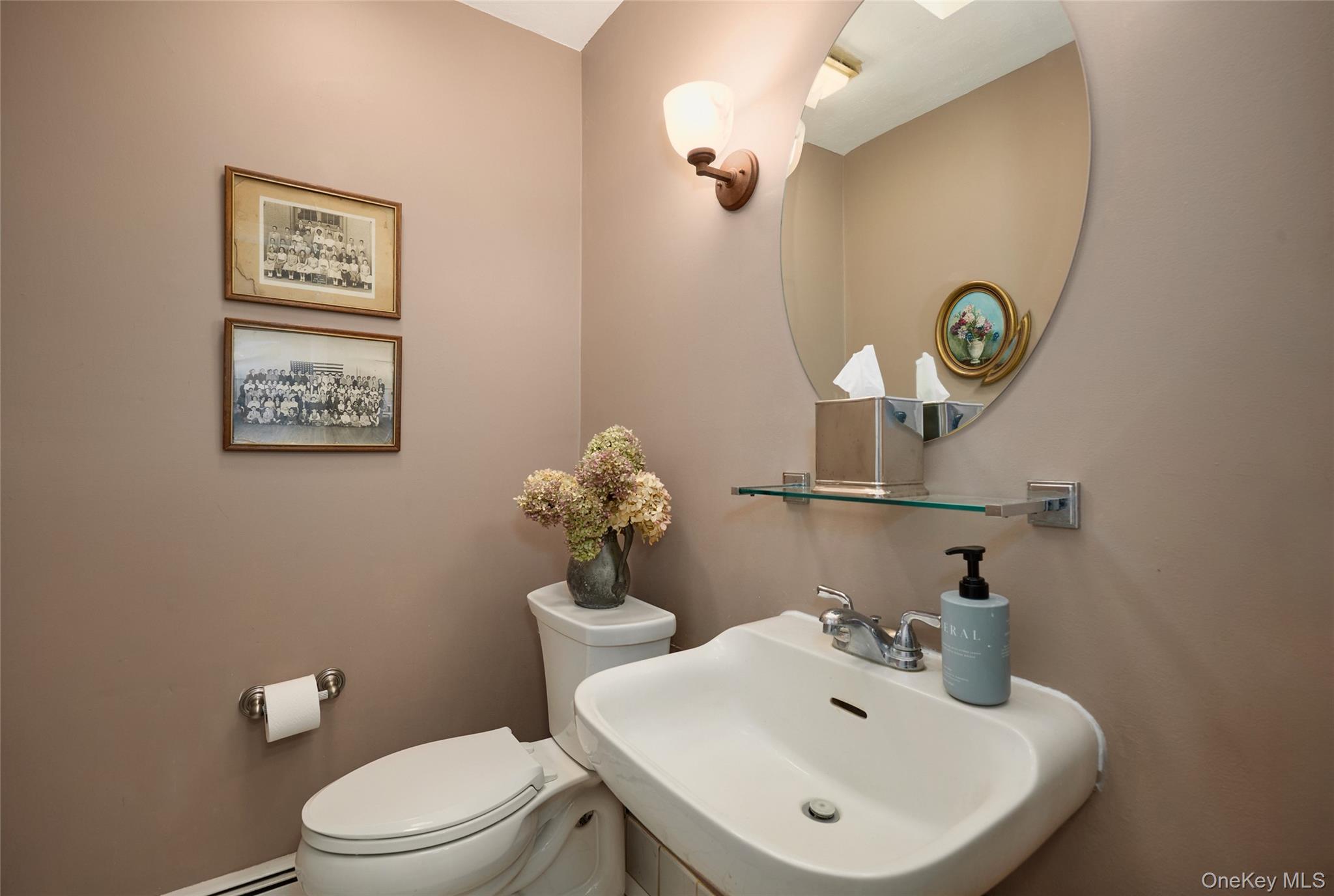 31 Greenlawn Road Katonah, NY 10536 - Photo 16 of 47 Half bathroom with a sink, toilet, and a baseboard radiator