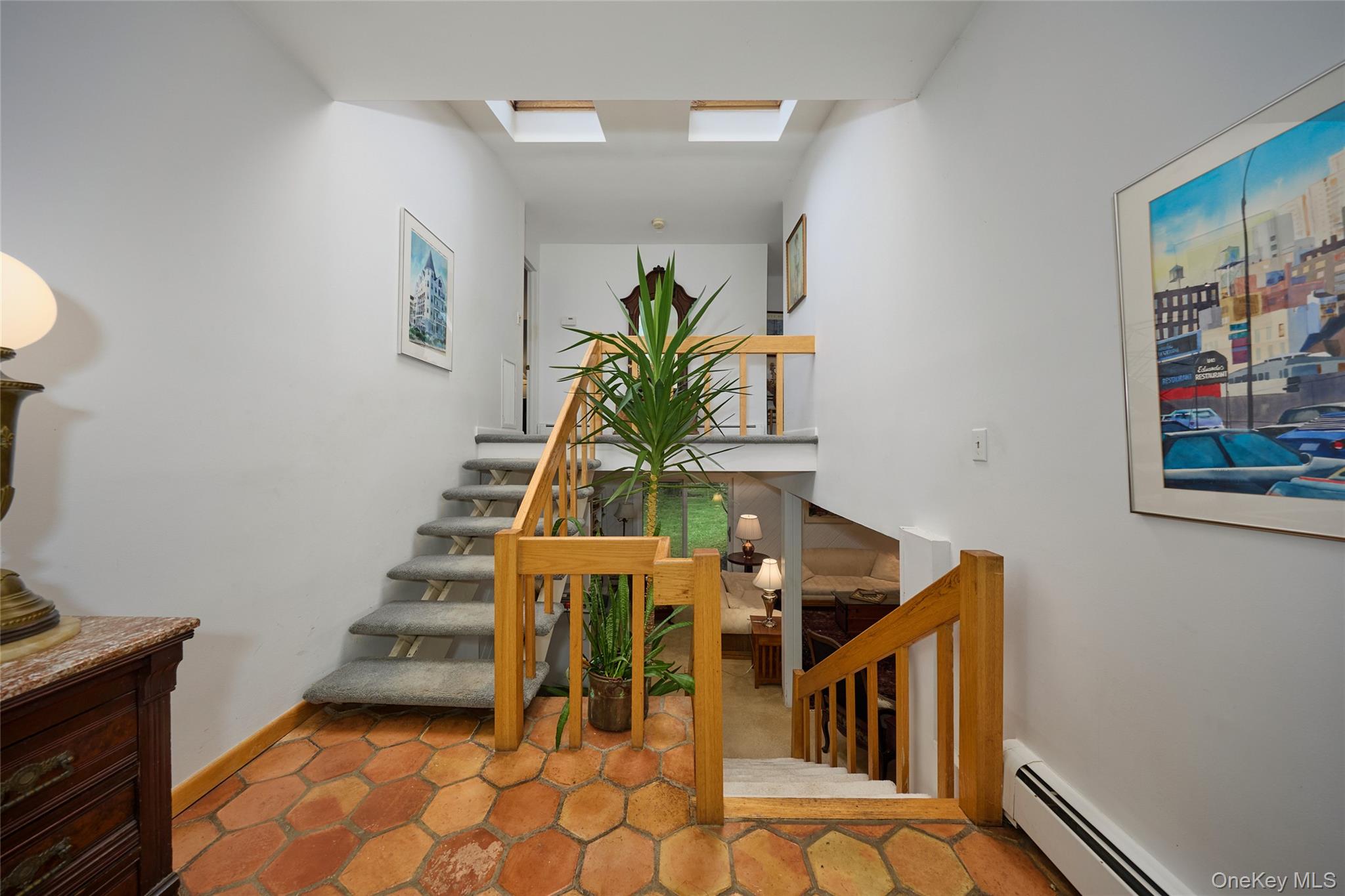 31 Greenlawn Road Katonah, NY 10536 - Photo 23 of 47 Stairway with a baseboard heating unit and baseboards