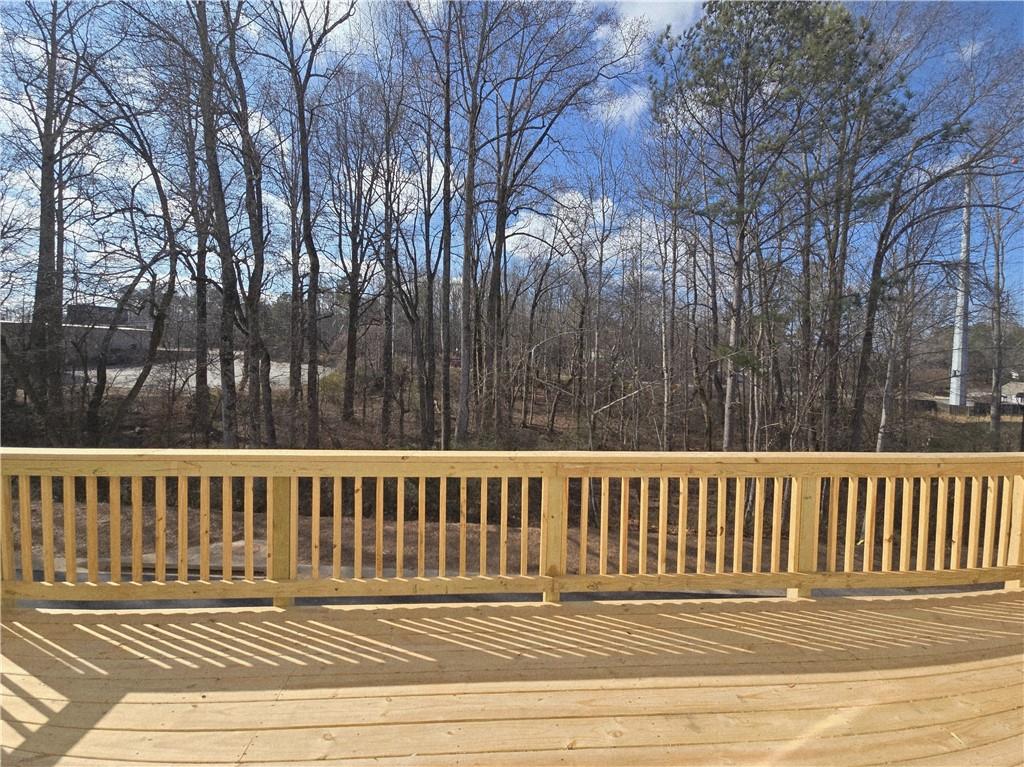 163 Basil Street Cumming, GA 30040 - Photo 19 of 56 a view of a wooden deck