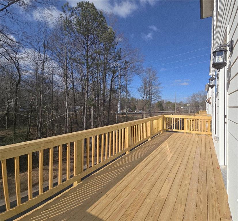 163 Basil Street Cumming, GA 30040 - Photo 20 of 56 a view of balcony with wooden floor and fence