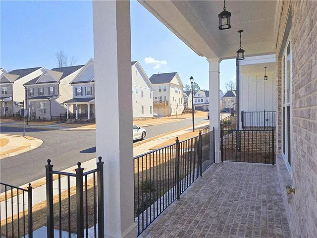 a view of a living room and balcony