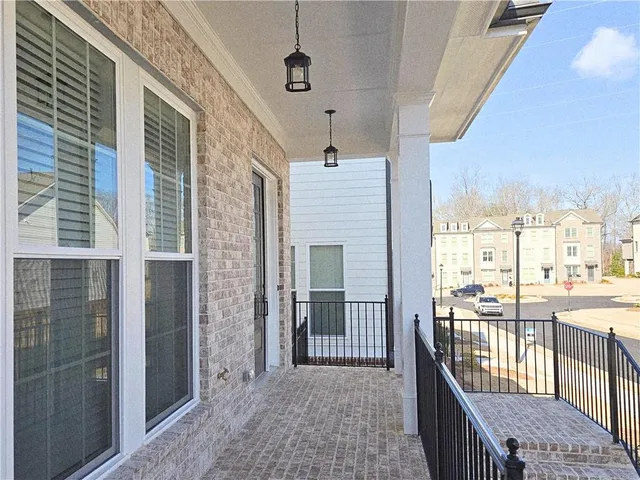 a view of a balcony with wooden floor