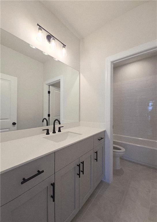 163 Basil Street Cumming, GA 30040 - Photo 41 of 56 a bathroom with a double vanity sink and a mirror